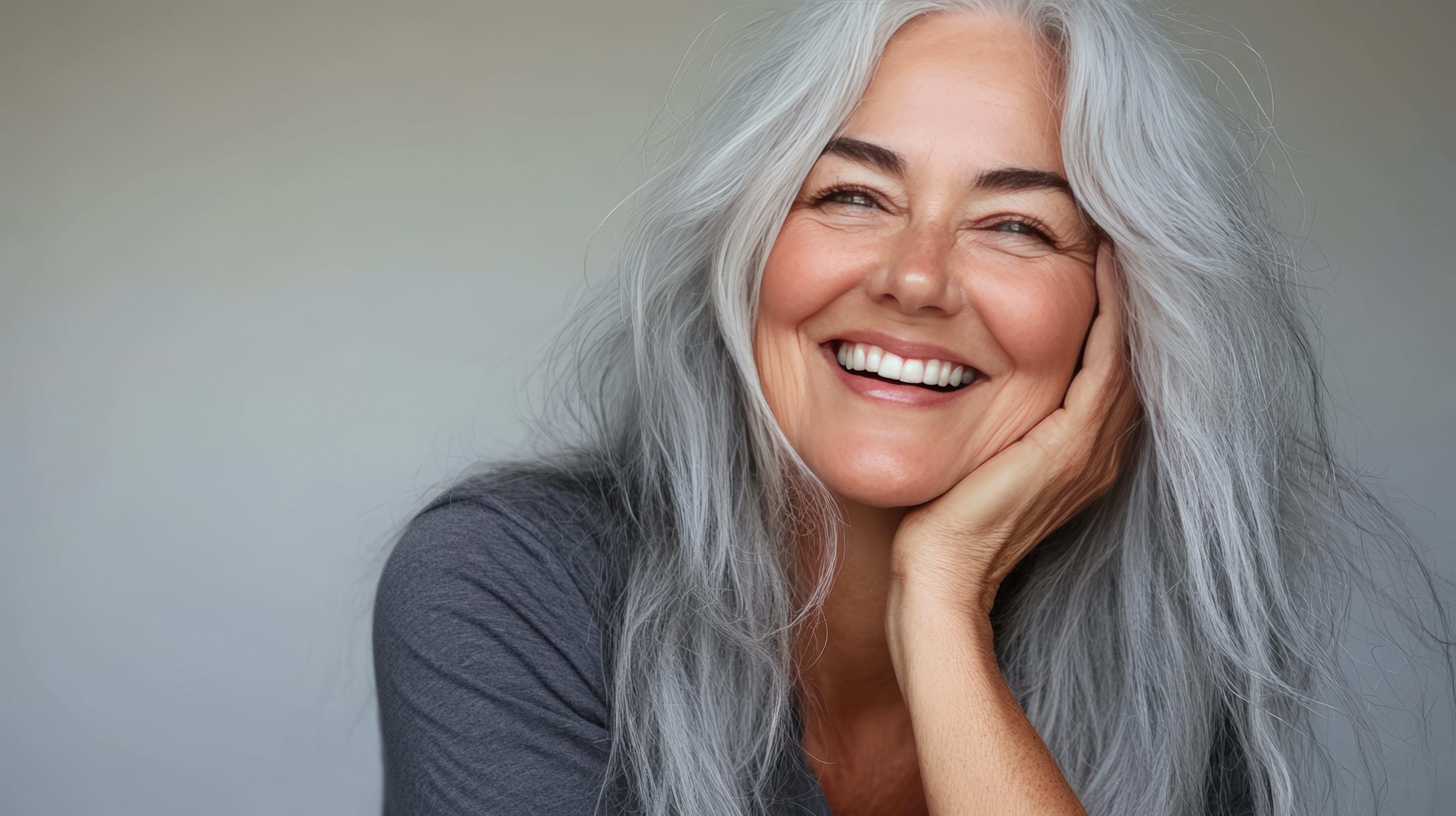 smiling-beautiful-woman-with-long-silver-hair-radiating-warmth-confidence